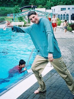 jump ito a pool in a wet hoodie
