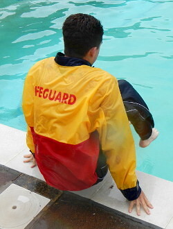 pool lifeguard swimming in uniform clothes