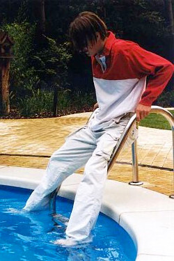 trousers and rugby shirt in pool