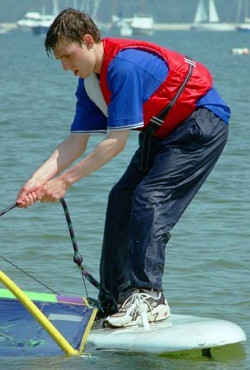 windsurfing in wet clothes pants and shirt